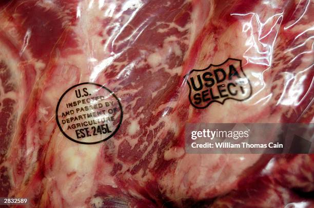 Side of beef is shown with the USDA inspection stamp at Wilson's Blue Ribbon Meats December 26, 2003 in Fairless Hills, Pennsylvania. Authorities...