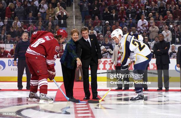 Shane Doan of the Phoenix Coyotes and Greg Johnson of the Nashville Predators take the ceremonial puck drop from Glendale, Arizona Mayor Elaine...