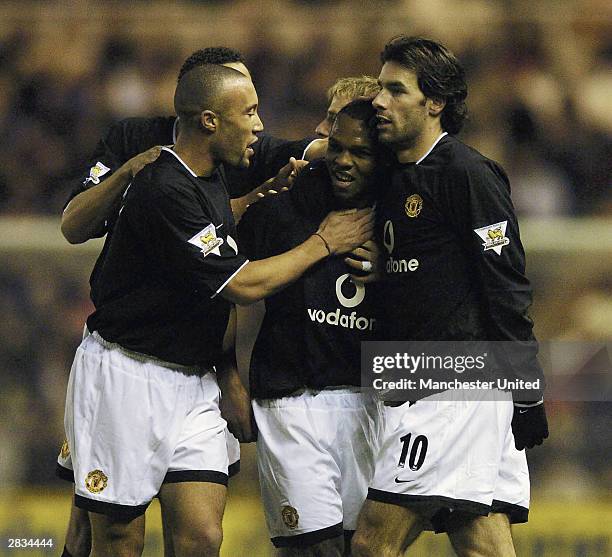 Quinton Fortune of Manchester United celebrates scoring the first goal with Mikael Silvestre and Ruud van Nistelrooy during the FA Barclaycard...