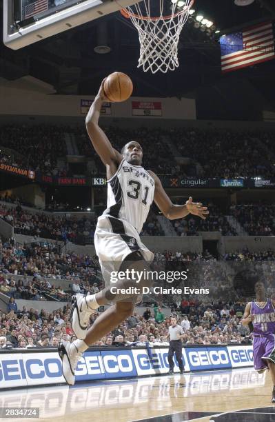 Malik Rose of the San Antonio Spurs lays up against the Milwaukee Bucks during the game on December 28, 2003 at the SBC Center in San Antonio, Texas....