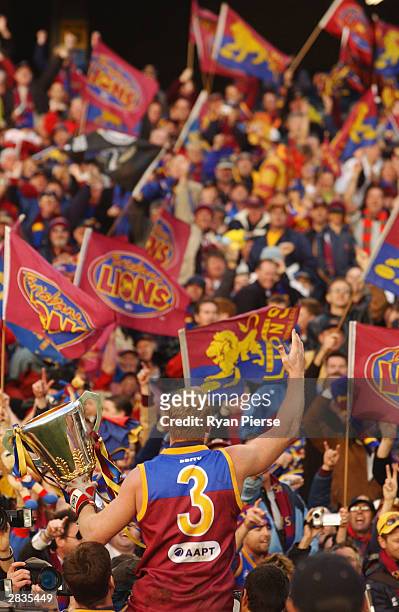 Michael Voss for the Lions celebrates with the crowd after the AFL Grand Final between the Collingwood Magpies and the Brisbane Lions at the...