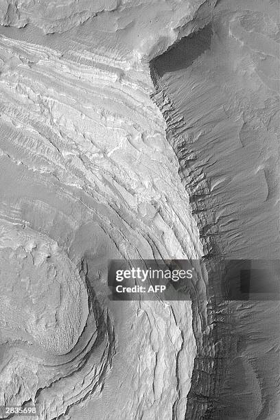 This NASA Mars Global Surveyor Mars Orbiter Camera image obtained 29 December 2003 shows layered sedimentary rock outcrops in Terby Crater on Mars....