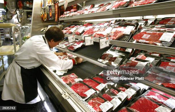Butcher arranges meat products at a grocery December 29, 2003 in New York City. U.S. Agriculture officials on December 28 insisted there was no risk...