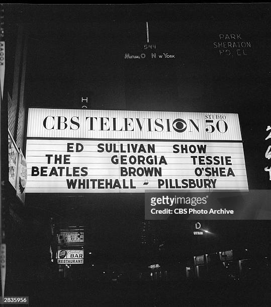 View of the marquee outside CBS's Studio 50, advertising 'The Ed Sullivan Show' featuring the Beatles, Georgia Brown, and Tessie O'Shea, New York,...