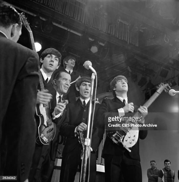 American television show host Ed Sullivan and members of the British Rock group the Beatles pose after a performance on 'The Ed Sullivan Show' at...
