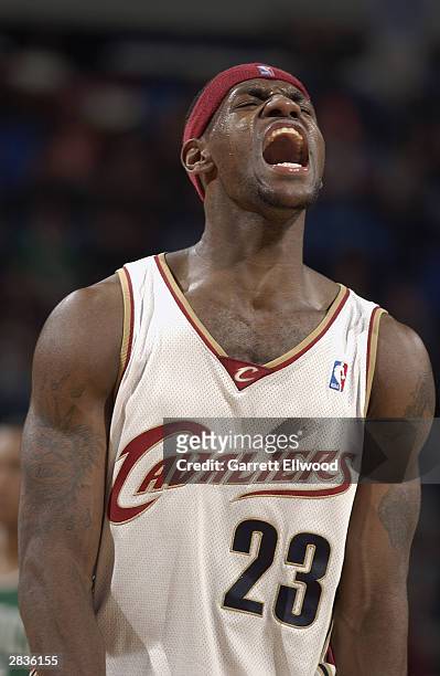 LeBron James of the Cleveland Cavaliers yells during the game against the Boston Celtics at Gund Arena on December 13, 2003 in Cleveland, Ohio. The...
