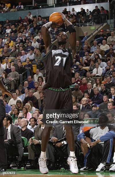 Kevin Garnett of the Minnesota Timberwolves shoots against the Boston Celtics during the game at the Fleet Center on December 15, 2003 in Boston,...
