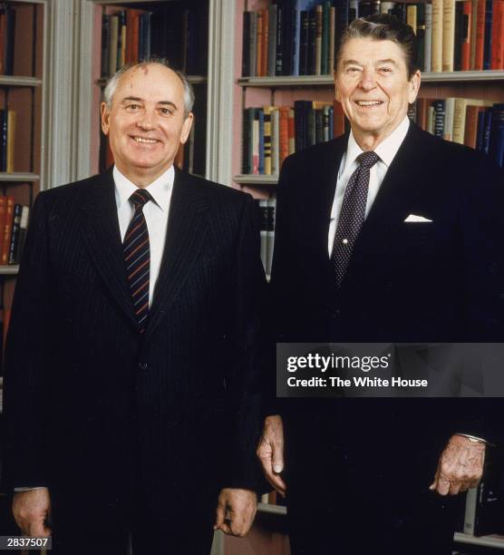 Soviet President Mikhail Gorbachev & American President Ronald Reagan pose together in the White House library, Washington DC, December 8, 1987.