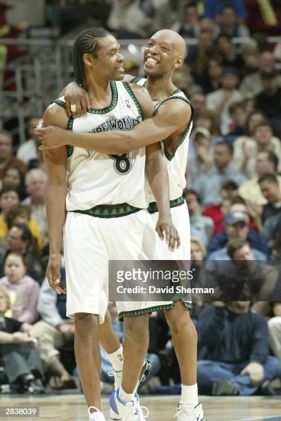 Sam Cassell of the Minnesota Timberwolves hugs his teammate Latrell Sprewell at the game against the Chicago Bulls on December 30, 2003 at Target...