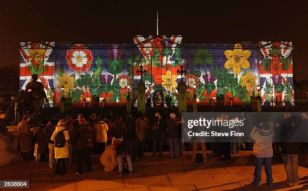 Buckingham Palace is lit up with artwork as part of a number of switch-on ceremonies leading up to Christmas and New Year on December 31, 2003 in...