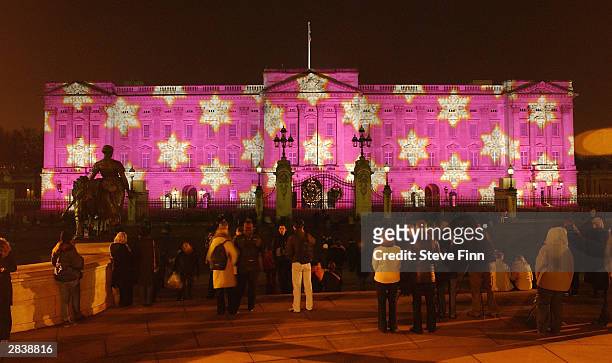 Buckingham Palace is lit up with artwork as part of a number of switch-on ceremonies leading up to Christmas and New Year on December 31, 2003 in...