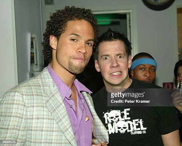 Quddus and Pierre Bouvier, lead singer of Simple Plan pose backstage during the "MTV New Year's Eve: 2004" celebration on December 31, 2003 at the...