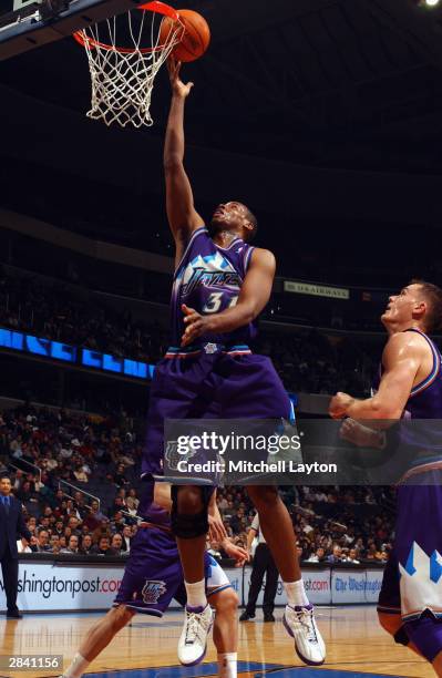 Jarron Collins of the Utah Jazz shoots a layup during the game against the Washington Wizards at the MCI Center in Washington, D.C. On December 16,...