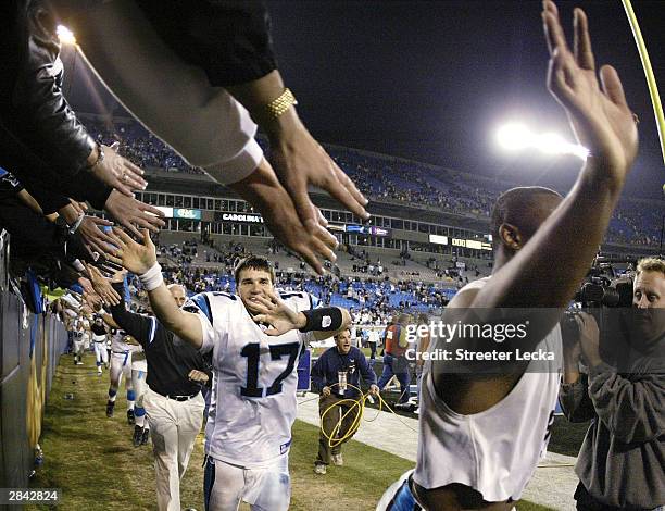 Jake Delhomme of the Carolina Panthers and his teammates make a lap around the field to thank fans after their 29-10 defeat of the Dallas Cowboys at...