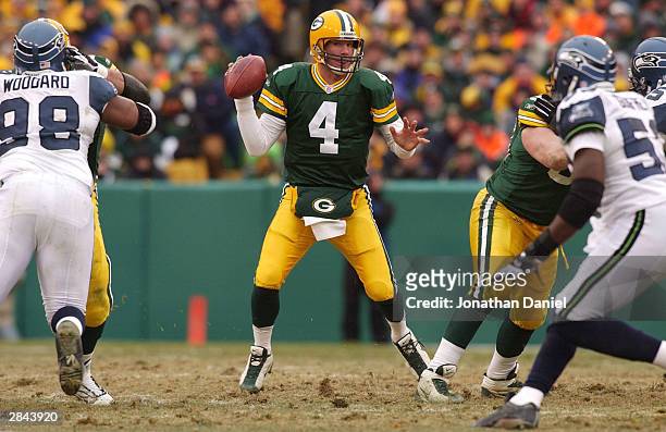 Quarterback Brett Favre of the Green Bay Packers looks for a receiver against the Seattle Seahawks on January 4, 2004 at Lambeau Field in Green Bay,...