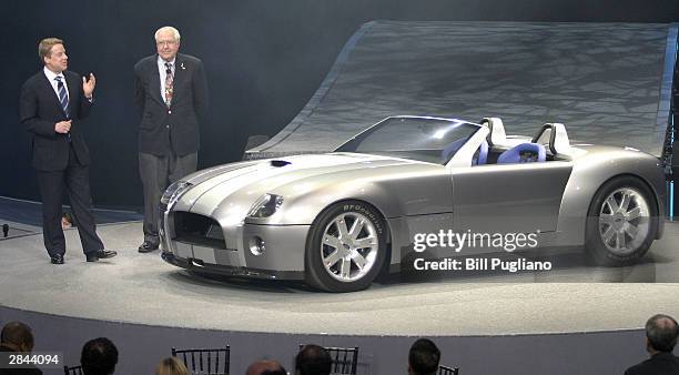 Ford Motor Company President and CEO William Clay Ford Jr. Talks with race car driver Carroll Shelby during the introduction of the new Ford Shelby...