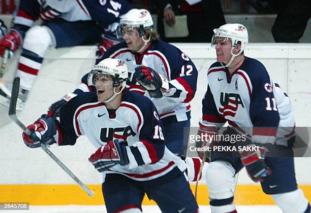 Jake Dowell , Patrick Osullivan and Zach Parise of the US team celebrate after winning the final of the U20 Icehockey World Championship match...