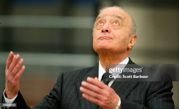 Mohamed Al Fayed gestures as he leaves after attending the opening of the inquest into the death of Diana, Princess Of Wales on January 06, 2004 in...