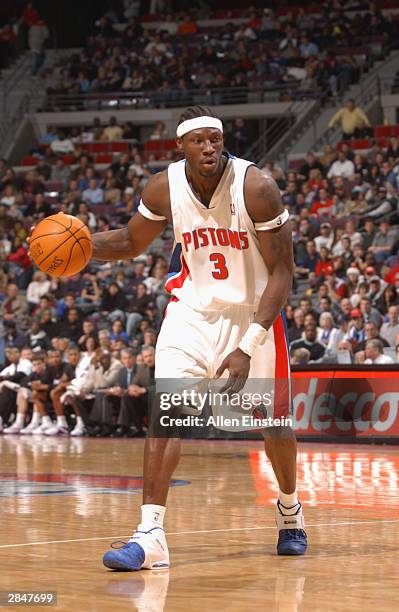 Ben Wallace of the Detroit Pistons moves the ball against the Utah Jazz during the game on December 21, 2003 at Palace of Auburn Hills in Auburn...