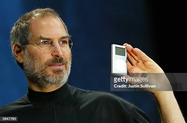 Apple CEO Steve Jobs holds a new mini iPod at Macworld January 6, 2004 in San Francisco. Jobs announced several new products including the new iLife...