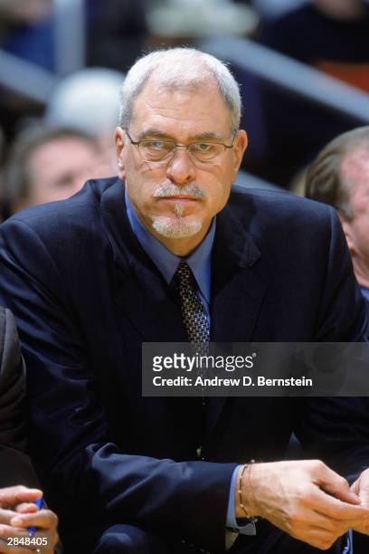Head coach Phil Jackson of the Los Angeles Lakers watches the game as he is sitting on the bench during the game against the Boston Celtics on...