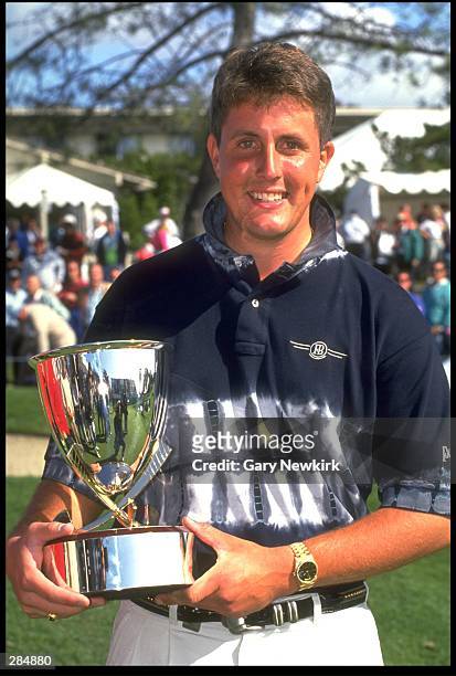 Phil Mickelson holds his trophy from the Buick Invitational of California at Torrey Pines Golf Club in San Diego, California. Mandatory Credit: Gary...