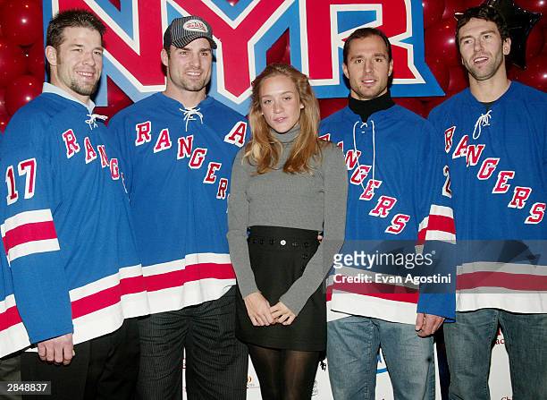 Actress Chloe Sevigny poses with New York Rangers hockey players at The Second Annual Eric Lindros Celebrity Mini-Golf Classic to benefit Children's...