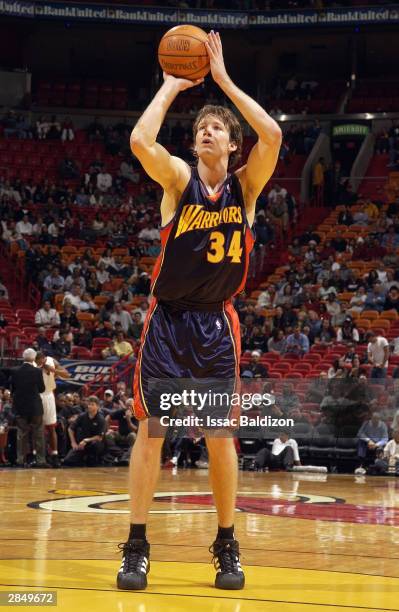 Mike Dunleavy of the Golden State Warriors shoots a free throw during the game against the Miami Heat on December 21, 2003 at American Airlines Arena...