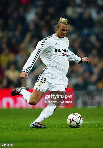 David Beckham of Real Madrid strikes the ball during the Primera Liga match between Real Madrid and Deportivo La Coruna on December 14, 2003 at the...