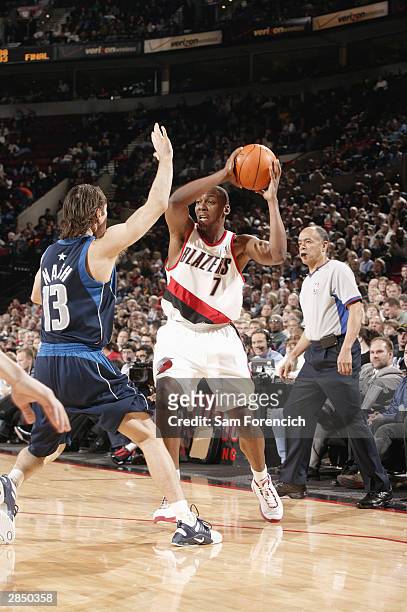 Wesley Person of the Portland Trail Blazers holds the ball as he is covered by Steve Nash of the Dallas Mavericks during the game at the Rose Garden...