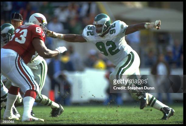 PHILADELPHIA EAGLES DEFENSIVE END REGGIE WHITE ATTEMPTS TO BREAK THROUGH THE PHOENIX CARDINALS OFFENSIVE LINE DURING THE EAGLES 23-21 VICTORY OVER...