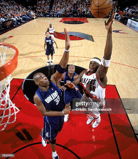 Zach Randolph of the Portland Trail Blazers shoots over Antawn Jamison of the Dallas Mavericks during the NBA game at The Rose Garden on December 23,...