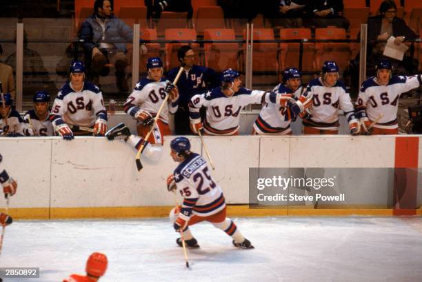 Buzz Schneider of the United States skates in front of his bench as time winds down during the Olympic hockey game against the Soviet Union on...