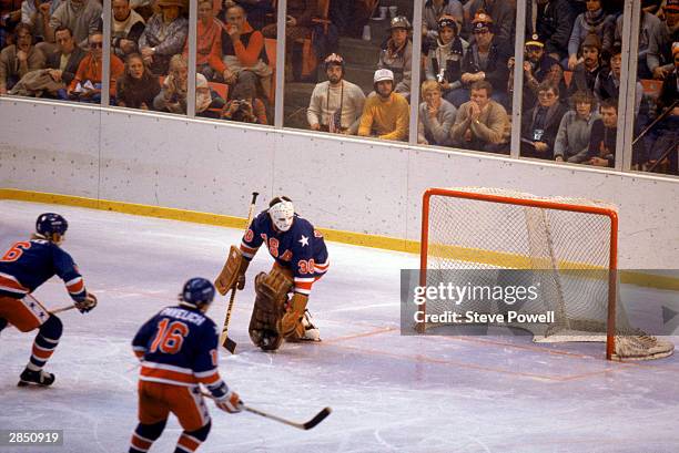 Goalie Jim Craig of the United States watches the puck sail by during the Olympic hockey game against Finland on February 24, 1980 in Lake Placid,...