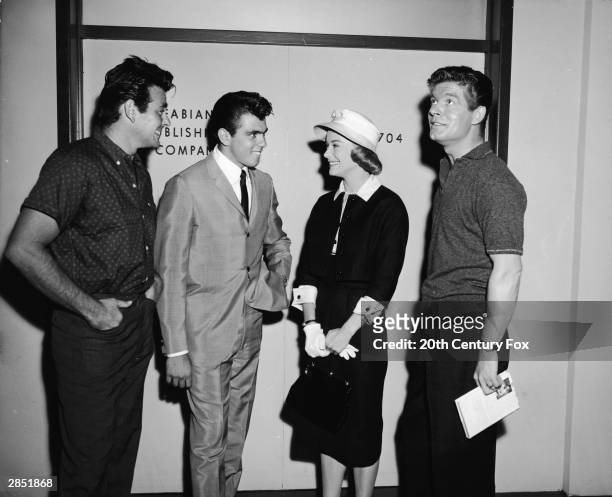 American actor Stuart Whitman and American singer and actor Fabian , the stars of the 1960 film 'Hound-Dog Man,' directed by Don Siegel, meet...