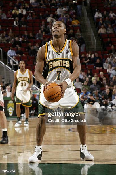 Rashard Lewis of the Seattle Sonics shoots a free throw during the game against the San Antonio Spurs on December 19, 2003 at Key Arena in Seattle,...