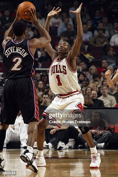 Jamal Crawford of the Chicago Bulls plays defense as DeShawn Stevenson of the Utah Jazz looks to pass the ball during the game on December 22, 2003...