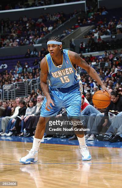 Carmelo Anthony of the Denver Nuggets looks to move the ball during the game against the Los Angeles Clippers at Staples Center on December 31, 2003...