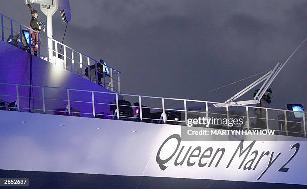 Lone piper on the Queen Mary 2 Cruise liner at Southampton 8 January 2004, during the naming ceremony by Britain's Queen Elizabeth II. The GBP550...