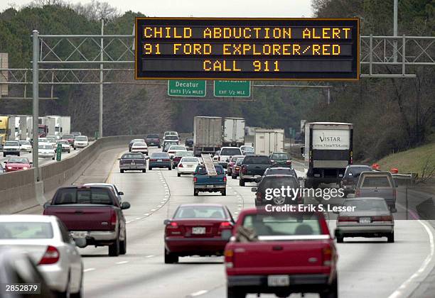 Georgia Department of Transportation sign alerts drivers to look for the vehicle of quadruple murder and kidnapping suspect Jerry William Jones...