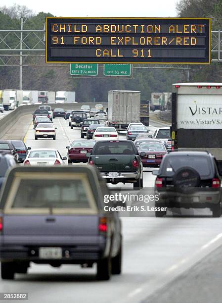 Georgia Department of Transportation sign alerts drivers to look for the vehicle of quadruple murder and kidnapping suspect Jerry William Jones...