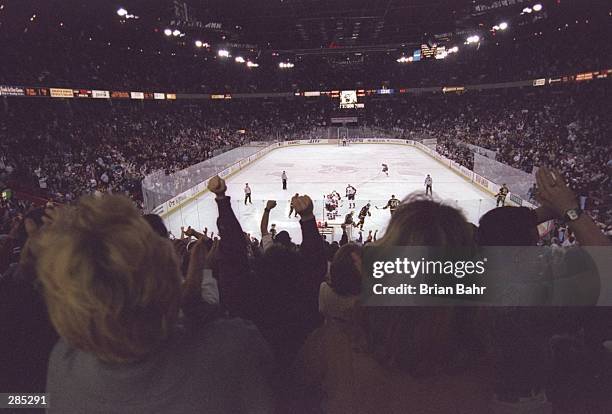 Colorado Avalanche fans celebrate Scott Youngs goal during a game against the Vancouver Canucks at the McNichols Sports Arena in Denver, Colorado....