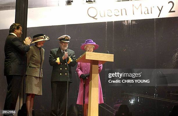 Queen Elizabeth II , joined by Commodore Ronald Warwick ceremoniously names the Queen Mary 2 cruise liner in Southampton Docks, 08 January 2004, in...