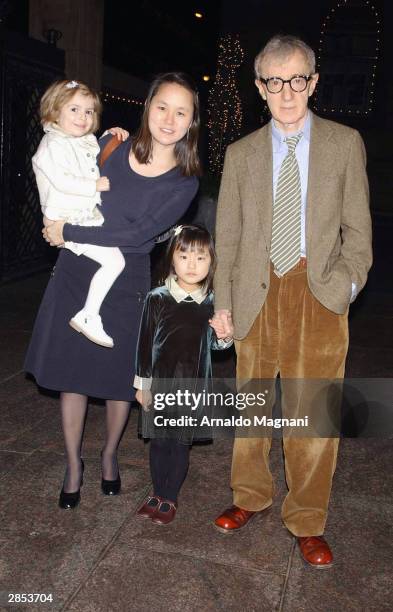 Filmmaker Woody Allen and his family, daughter Manzie, wife Soon-Yi and daughter Bechet pause on their way to New Year's Eve dinner at LeCirque...