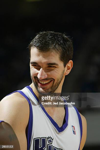 Peja Stojakovic of Sacramento Kings smiles during the game against the Portland Trail Blazers at Arco Arena on December 21, 2003 in Sacramento,...