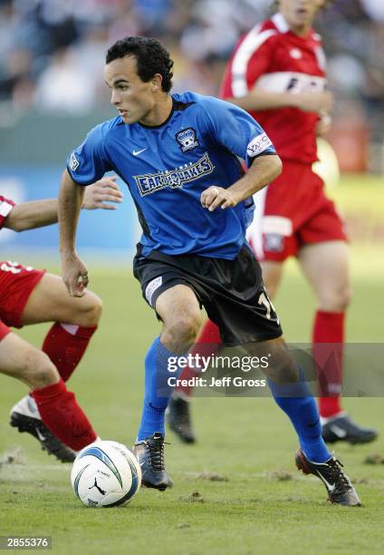 Landon Donovan of the San Jose Earthquakes dribbles against the defense of the Chicago Fire during the MLS Cup on November 23, 2003 at the The Home...