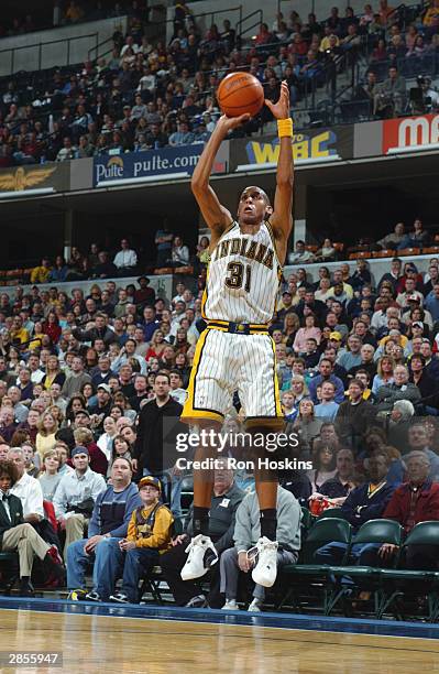 Reggie Miller of the Indiana Pacers shoots a 3-pointer during the game against the New Orleans Hornets on January 3, 2004 at Conseco Fieldhouse in...