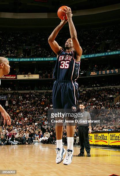 Jason Collins of the New Jersey Nets takes a jumper against Derrick Coleman of the Philadelphia 76ers January 9, 2004 at the Wachovia Center in...