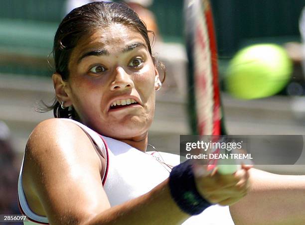 Defending champion Eleni Daniilidou of Greece plays a forehand during her final singles match against Ashley Harkleroad of the USA on finals day of...