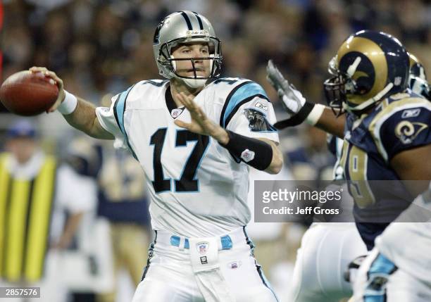Quarterback Jake Delhomme of the Carolina Panthers gets a pass off despite the pressure from Ryan Pickett of the St. Louis Rams in the NFC Divisional...